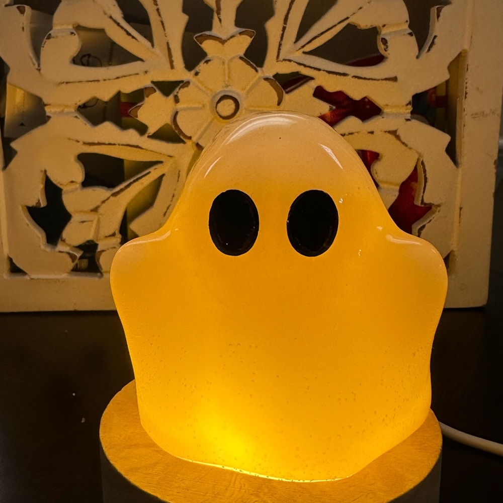 Resin ghost with light stand.